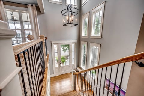 The view of the front door from the top of the stairs/living room.