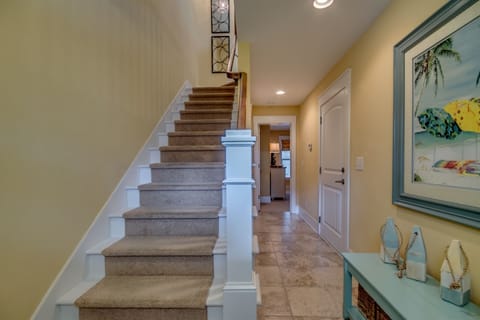 The open door shown at the end of the hallway is where you access Guest 1 bedroom and bathroom.