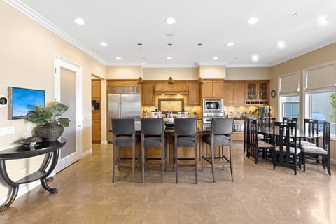 2021 - kitchen with gas stove, bar seating and table