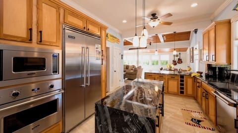 The gourmet kitchen has top of the line stainless steel appliances...
