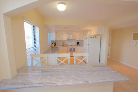 Entertain while prepping that Family Meal in this stylish newly updated Kitchen and Breakfast Bar with Granite Counter Tops.