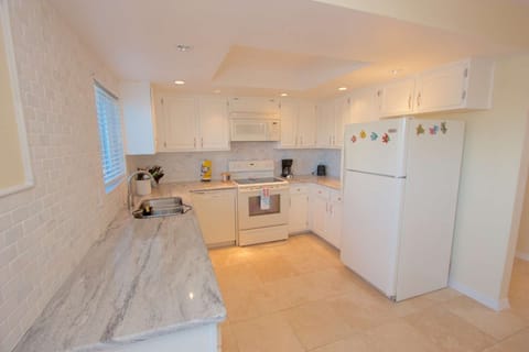 Pack a lunch for the family or enjoy whipping up a an amazing meal in this beautifully updated and stocked kitchen with brand new granite counter tops