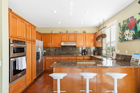 Kitchen with stainless appliances and bar stools - STR14-0092