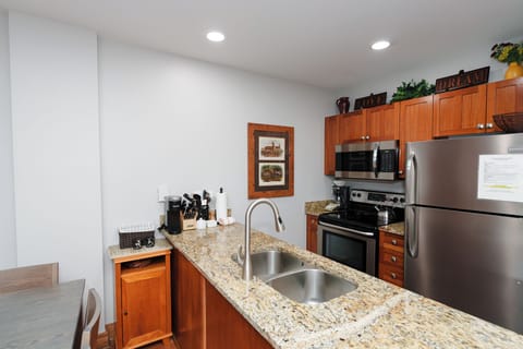Your fully equipped kitchen features granite countertops, stainless steel appliances, and all the essentials you need to prepare meals during your stay.