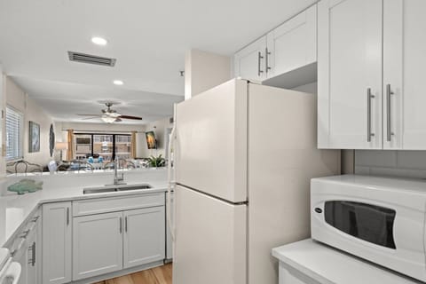 Pass Through Window from the Kitchen to Dining and Living Room