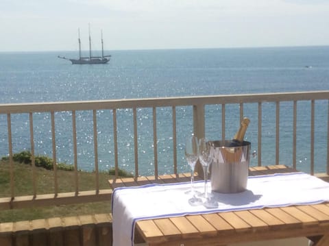 Front balcony with stunning views, dining table, chairs and quality sunloungers
