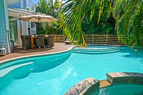 Welcome to your private backyard oasis with a large heated pool and spa
