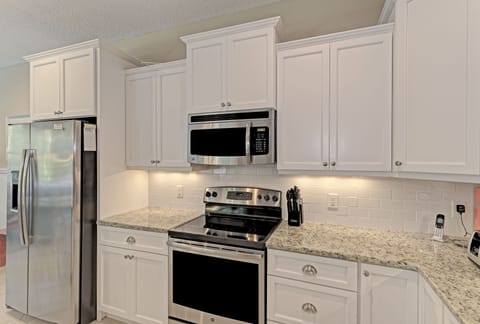 Kitchen has stainless steel appliances