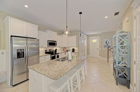 Kitchen island has adds additional seating for 4