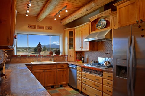 Upscale stainless appliances + wine cooler, granite counters & cabinets filled to delight the chef