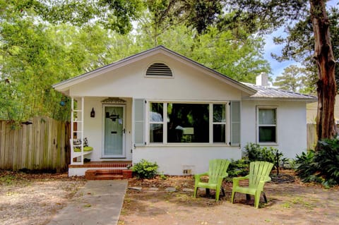 1049 Oceanview, 0.2 Miles to 5th Street Beach - This single-level St. Simons rental has a classic front porch, shaded oaks, and a walkable location near Crab Trap, Fiddlers, and Pier Village.