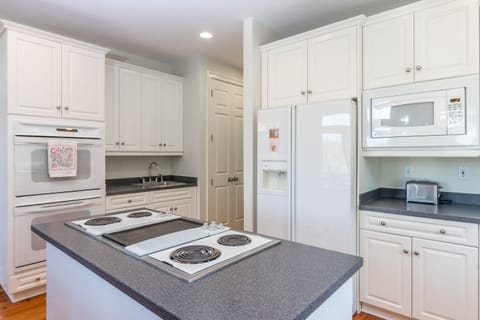 Kitchen is stocked with all the appliances and cookware (not to mention plenty of storage and counter space!) for meal prep