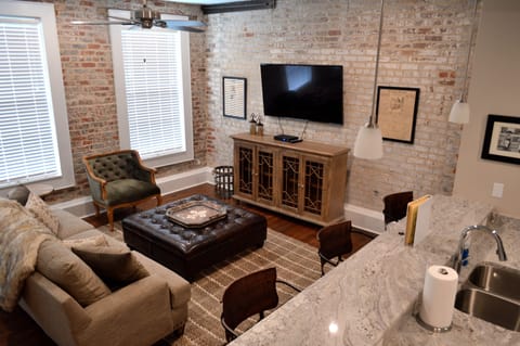 So many original features still here, original exposed brick, iron supports and wall medallions show the craftsmanship of this 1880's build