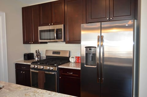 Stainless appliances, granite counters and solid wood cabinets in the kitchen with complementary waters and Gatorades in the fridge and 3, twelve cup packages of French Market Coffee for the drip style coffeemakers, to start off your stay with VacayNOLA and in New Orleans