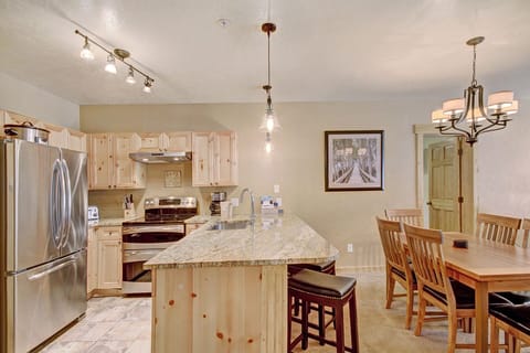 The kitchen overlooks the dining table and living room. 