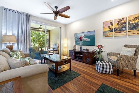 Luxury living room, large flat screen tv, beautiful artwork.