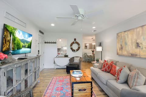 Living Room – Ocean Walk J-11 - Bright and breezy living space with coastal décor, smart TV, and open flow into the dining area. The perfect spot to unwind after a day at the beach.