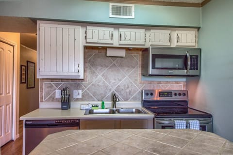 Cozy fully stocked kitchen.