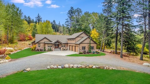 Grand Lodge Entry With Lawn and Car Parking, Timber Beams And Dramatic Peaks