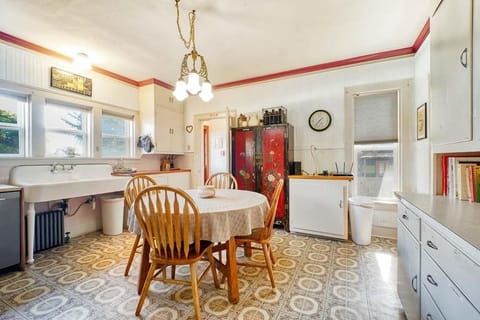 Enjoy your morning coffee with family in our cozy kitchen, featuring seating for four at the breakfast table.