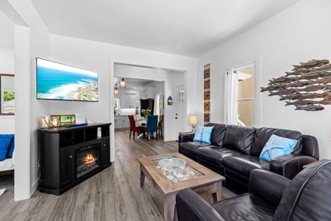 Living Room has a 48" TV, Fireplace and a Queen Sofa Bed