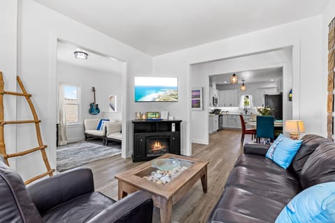 Living Room has a 48" TV, Fireplace and a Queen Sofa Bed