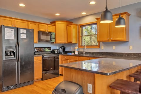 Modern Kitchen with Breakfast Bar Seating for 3.