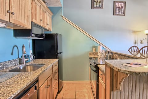 Kitchenette - There are granite counter tops in the kitchen, one housing the stainless steel sink and the table with seating for three. There is full stove, microwave, coffee maker, toaster, dishwasher and an average sized refrigerator