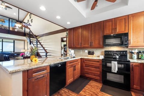 Fully Equipped Kitchen with Black Appliances