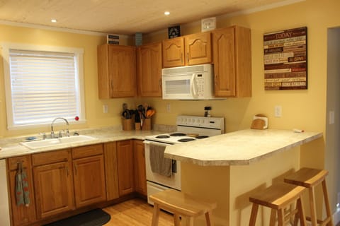 Beautiful kitchen which includes stove, microwave, dishwasher, etc.