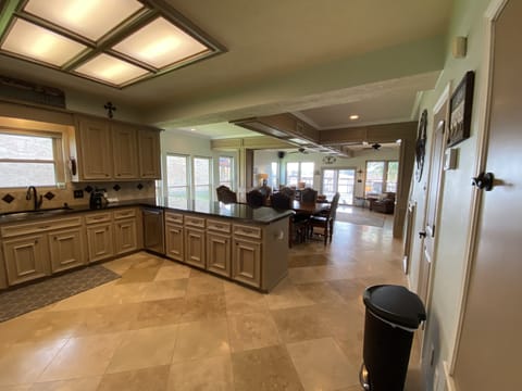 Kitchen table seats 8 with additional table that seats 4 more.