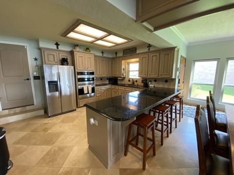 4 bar stools in addition to Kitchen table that seats 8