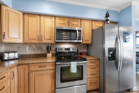 Kitchen has stainless steel appliances