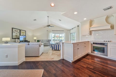 SW28503 - The inviting family room is equipped with a flat screen TV and offers beautiful lake and pool views