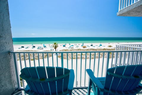 Private balcony, you'll wake to the sounds of the surf. Adirondack chairs will melt your worries away.