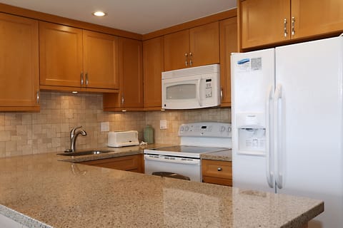 Fully equipped kitchen with new appliances and granite counters