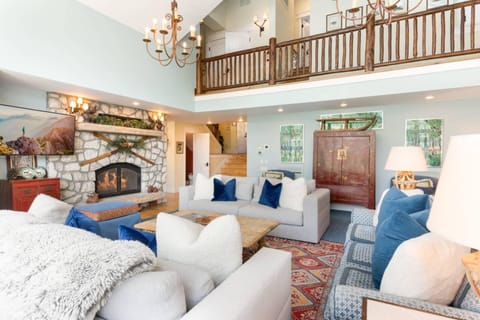 The stunning living room opens right up into the lofted floor above!