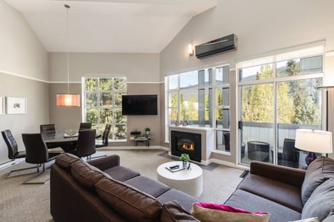 Generous living area with Vaulted ceilings AC, TV, gas fireplace and sundeck access