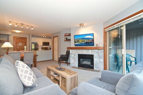 Open plan, gas fireplace , wall mounted TV