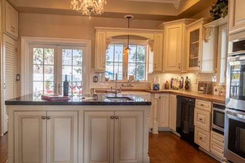 Into the spacious and naturally lit kitchen