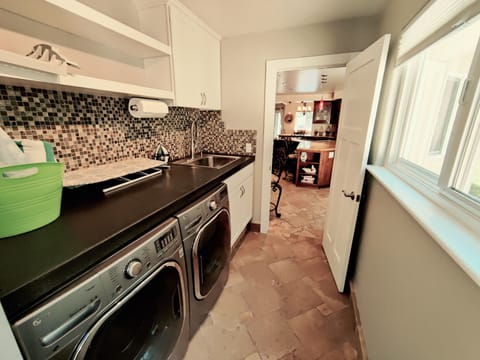 Laundry Room off the Kitchen, we provide Laundry Pods for your s