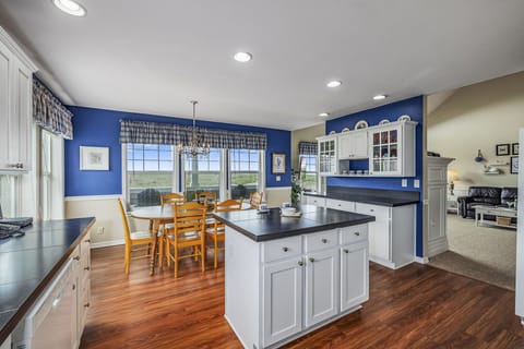 Panoramic kitchen views and high-top bar seating perfect for gathering