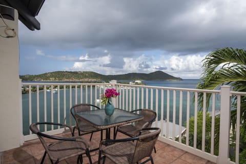 Outdoor dining with island and water views.