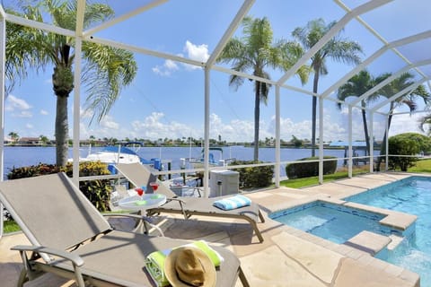 View of the large pool deck with spa and panoramic views over the 8 Lakes