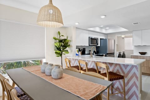 Plenty of seating at the dining table or kitchen bar!