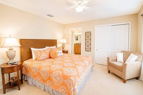 King Master Suite with closet, ceiling fan, additional seating, TV and private EnSuite