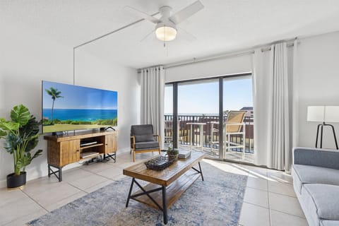 Bright and inviting living space with cozy seating and plenty of natural light