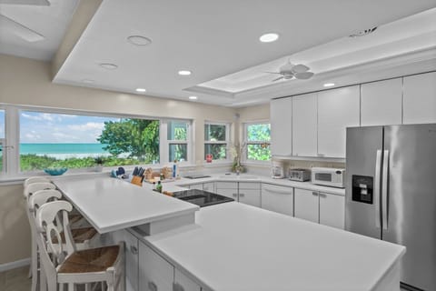 Kitchen with stainless steel appliances and breakfast bar