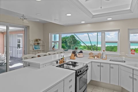 Kitchen with stainless steel appliances and breakfast bar