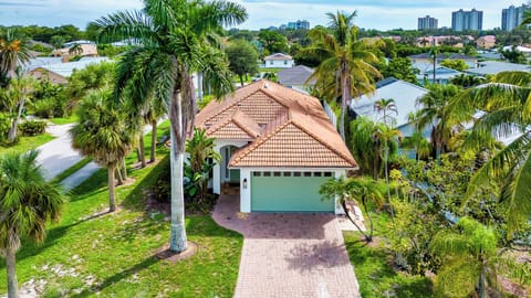 Exterior of Neapolitan Vacation Rental; Beautiful Tropical Landscape; Just 8 Minutes to Vanderbilt Beach! 